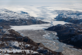 A glacier at the edge of the ice sheet, melting water and mud are pictured in the North of Kangerlussuaq, Greenland