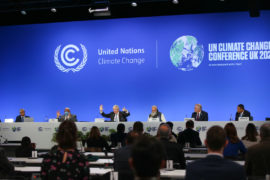 Boris Johnson makes the 1.5 degree hand gesture at COP26