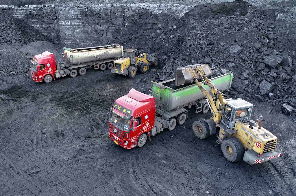 A loader loads coal for transport at an open-pit coal mine in Yijinhuoluo Banner, Inner Mongolia