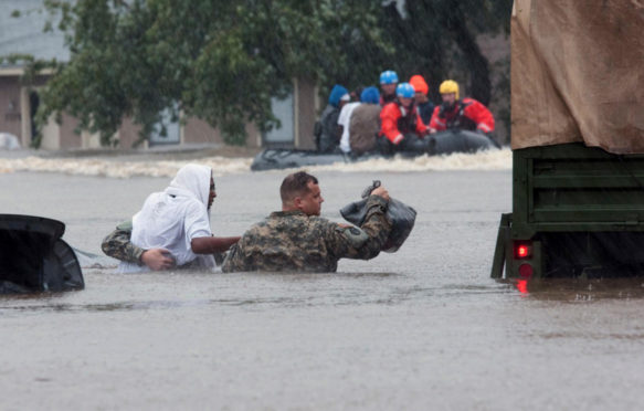 Army and local emergency services evacuate Fayetteville residents from floods caused by Hurricane Matthew_KHA8JE