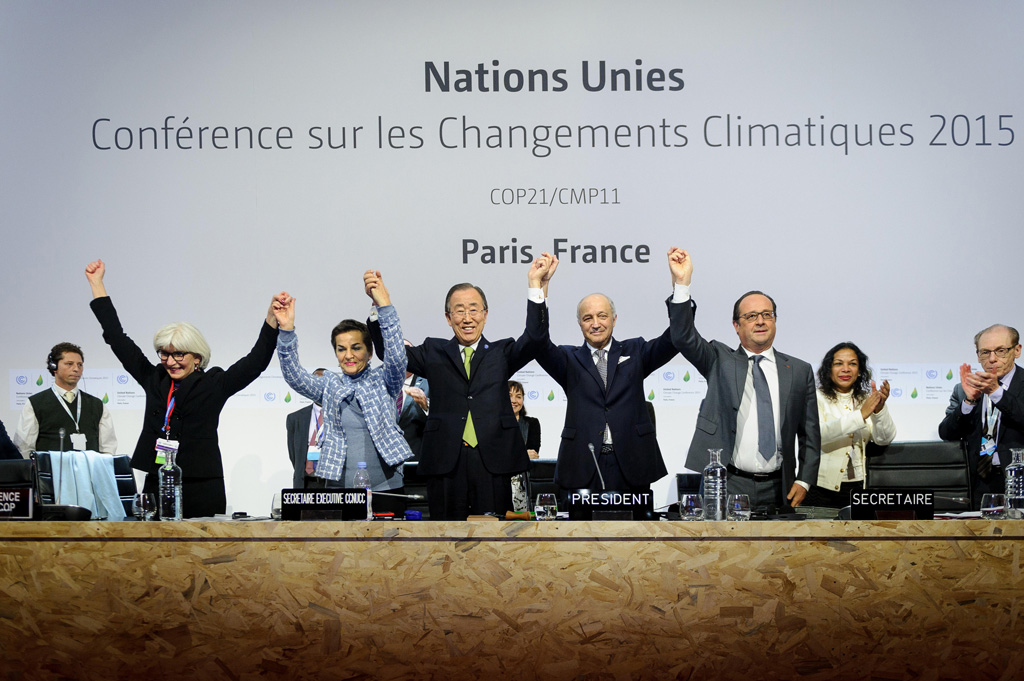 Leaders of COP21 celebrate the Paris Agreement on greenhouse gas emissions