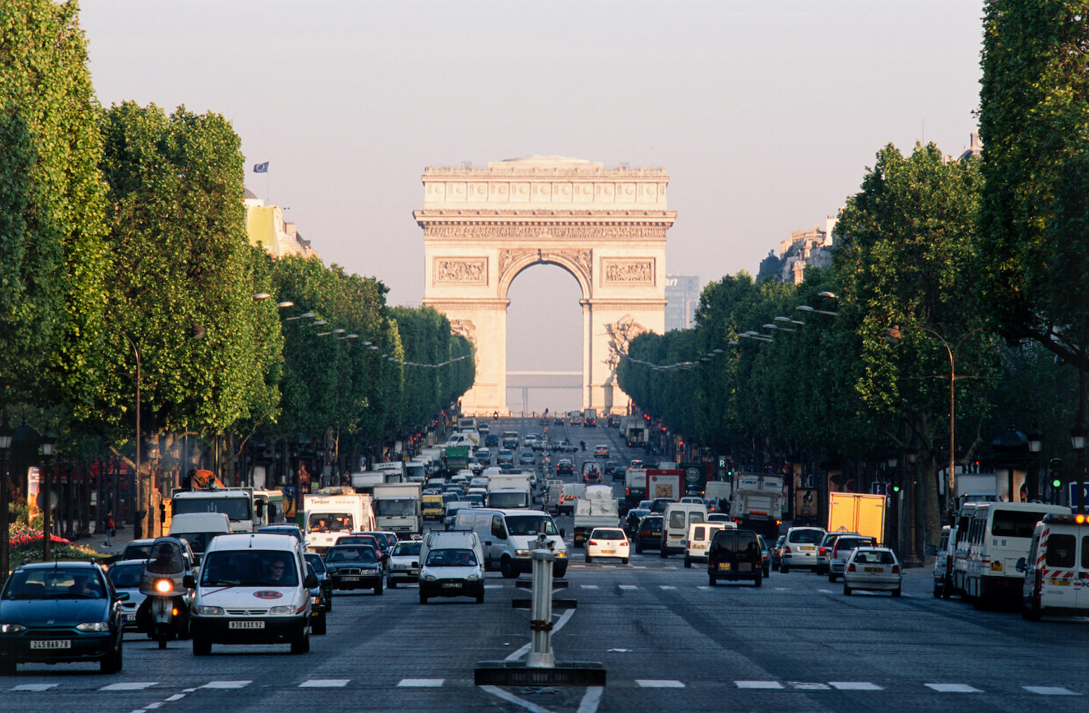 Champs-Elysees with view of the Arc de Triomphe in Paris, France
