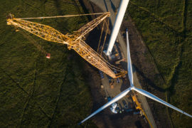 Wind turbine construction showing the propellor being prepared for lifting