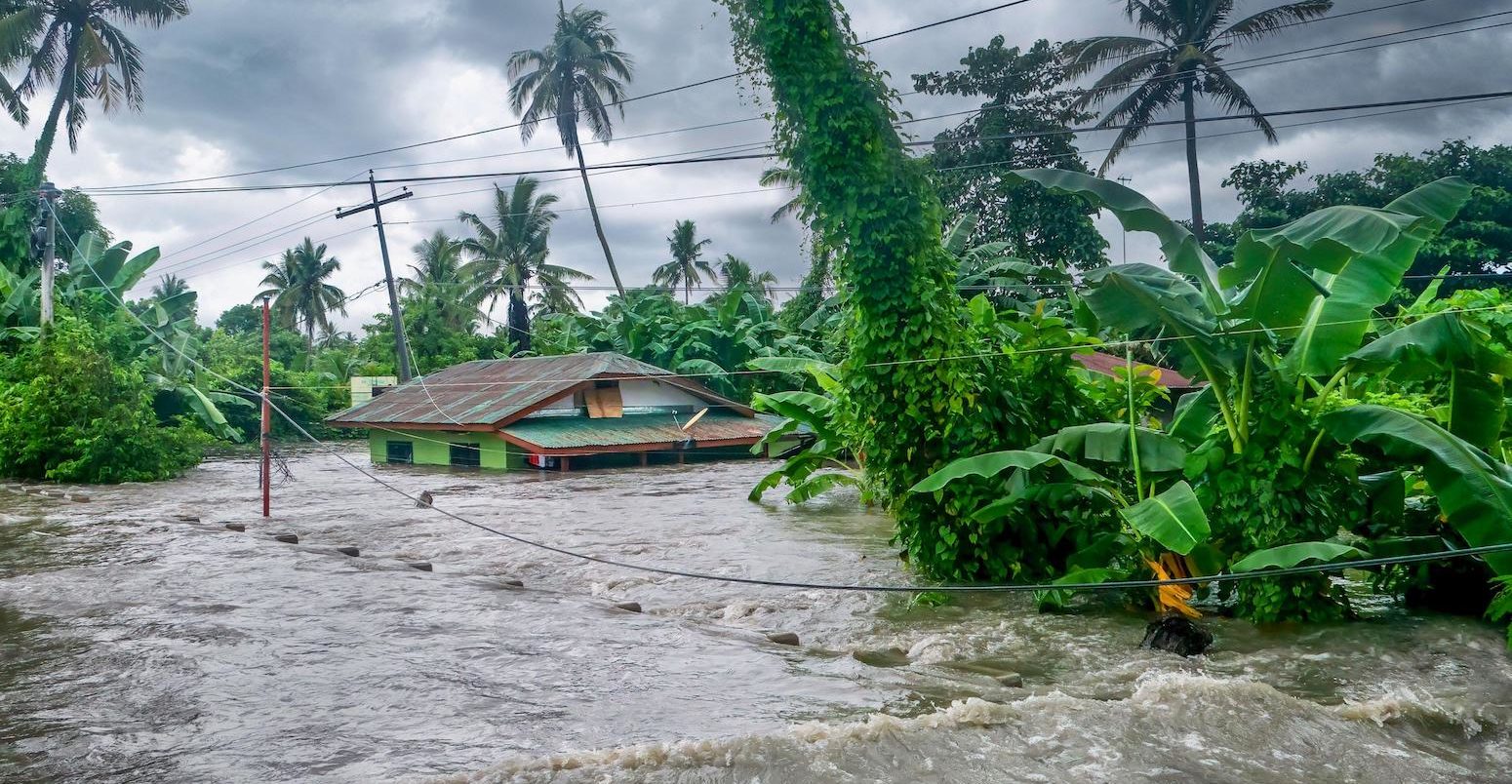 Rising water levels submerge a house as heavy monsoon rains cause major floods in Philippines