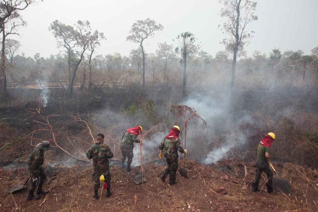 Firefighters on duty during the forest fires in the Amazon region, Otuquis, Bolivia, 26 August 2019.