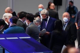 US Special Presidential Envoy for Climate John Kerry talks to delegates from China at COP26