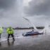 Yacht washed ashore and grounded during Storm Ciara at Cardwell Bay, Gourock, UK with H M Coastguard in attendance