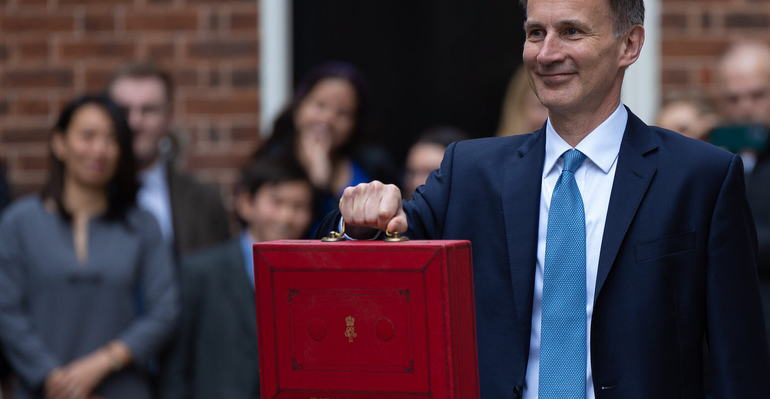 The Chancellor of the Exchequer Jeremy Hunt, accompanied by his ministerial team and watched by his wife and children, leaves 11 Downing Street on his way to deliver the budget on March 15, 2023.