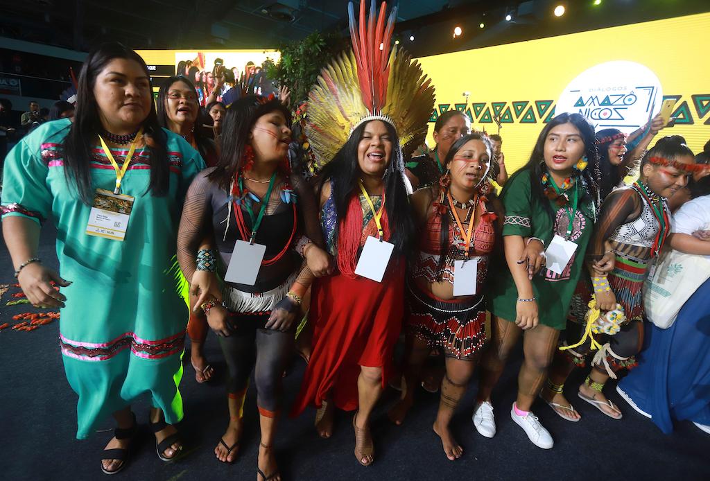 Sonia Guajajara, Minister of Indigenous Peoples, center, dances with Tembe Indigenous women during the Amazon Dialogue meeting at the Hangar convention center in Belem, Brazil, on 6 August 2023.
